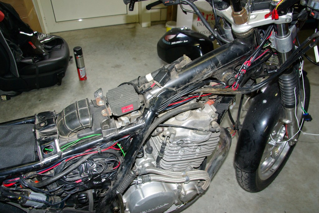 Wiring between the distributino box (left, in the black dry bag) and the cockpit.