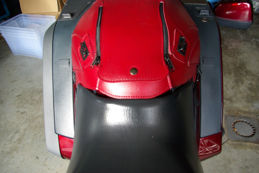 The original Honda fairing deflector installed (left) and not yet installed (right).